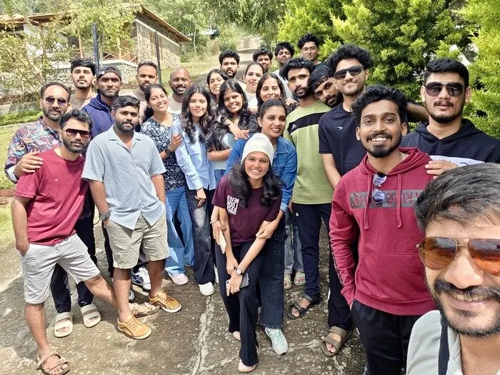 The team posing together on a tour